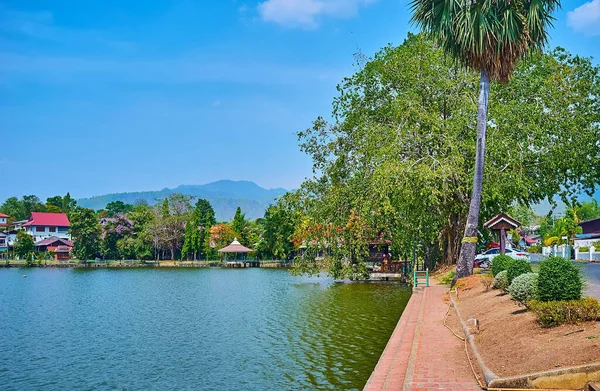 Enjoy the lakeside walk in lush green park, located on the bank of Nong Kham Lake, Mae Hong Son, Thailand