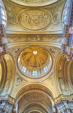 BRESCIA, ITALY - APRIL 10, 2022: Impressive vault and dome of Santa Maria della Pace Basilica with rich frescoed decor, on April 10 in Brescia