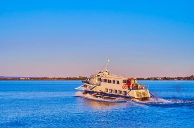 Azure Lake Garda with a view on the ferry, floating from Sirmione, Lombardy, Italy