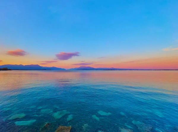 Picturesque Sunset Lake Garda Scenic Rippled Surface Silhouettes Garda Prealps — Stok fotoğraf