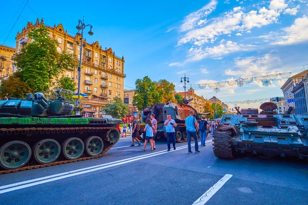 KYIV, UKRAINE - AUGUST 23, 2022: Locals explore destroyed Russian tanks on Khreshchatyk avenue, Independence Day, on August 24 in Kyiv, Ukraine