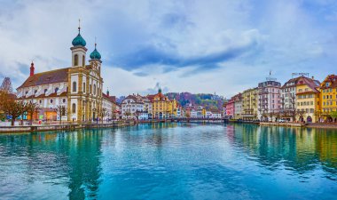 LUCERNE, SWITZERLAND - MARCH 30, 2022: Architectural masterpieces of Altstadt, located on the banks of Reuss river, on March 30 in Lucerne, Switzerland