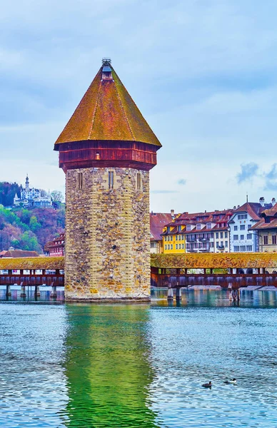 Wasserturm (Water Tower), the medieval tower in the middle of Reuss River in Lucerne, Switzerland