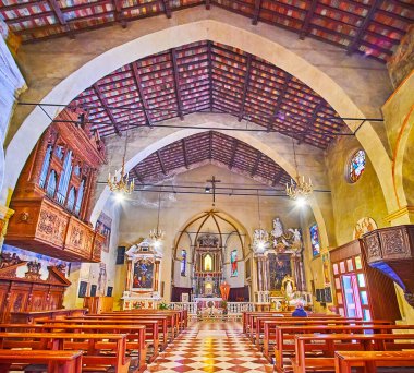 SIRMIONE, ITALY - APRIL 10, 2022: The prayer hall of Santa Maria della Neve Parish Church with timber vault, carved wooden organ, vintage chandeliers, icons and altar, on April 10 in Sirmione