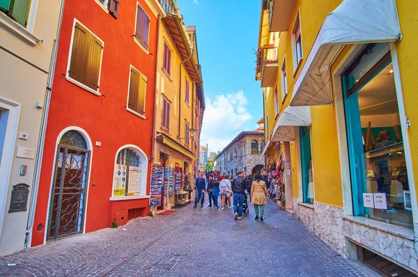 Via Vittorio Emanuele street with lines of historic houses, Sirmione, Italy