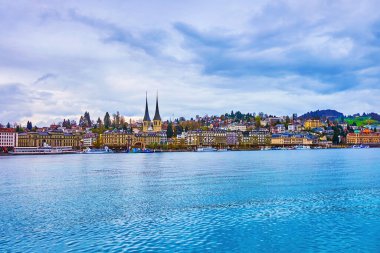 Historical part of Lucerne city with spires of Church of St. Leodegar on the bank of Lucerne Lake, Switzerland