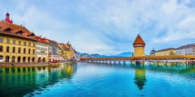 LUCERNE, SWITZERLAND - MARCH 30, 2022: Main landmarks on Reuss river in the heart of the old town, on March 30 in Lucerne, Switzerland