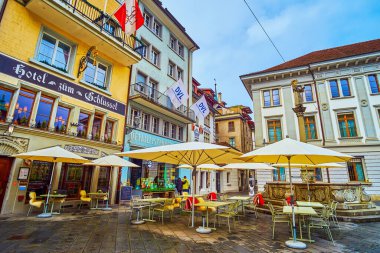 LUCERNE, SWITZERLAND - MARCH 30, 2022: Empty streets during rainy day in Altstadt, on March 30 in Lucerne, Switzerland