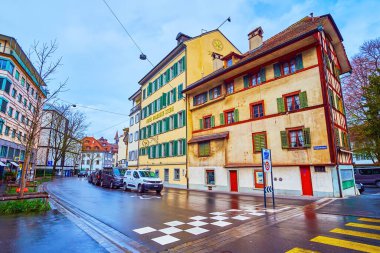 LUCERNE, SWITZERLAND - MARCH 30, 2022: Old neighborhood with historical houses on Burgerstrasse, on March 30 in Lucerne, Switzerland