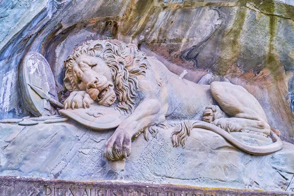 The masterpiece Lion Monument (Lowendenkmal) carved in a rocky cliff is the most famous landmark of Lucerne city, Switzerland