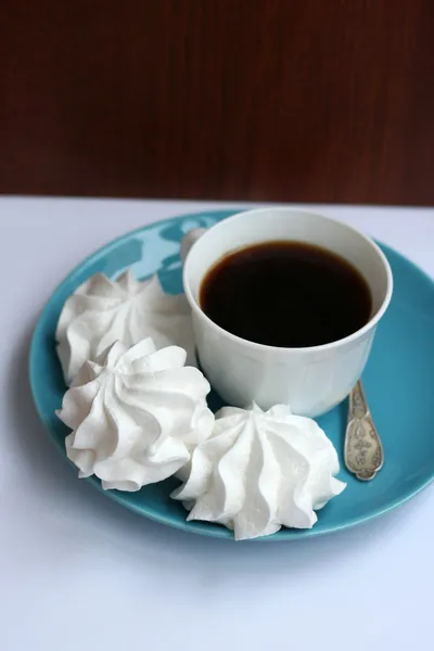 White merengues with cup of coffee — Stock Photo, Image