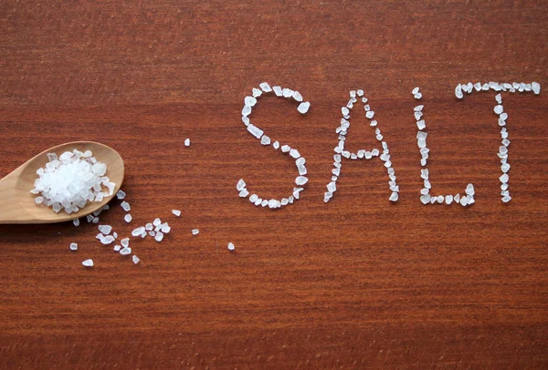 Sea salt in wooden wpoon — Stock Photo, Image