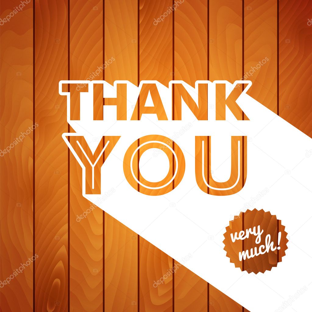Thank you card with typography on a wooden background.