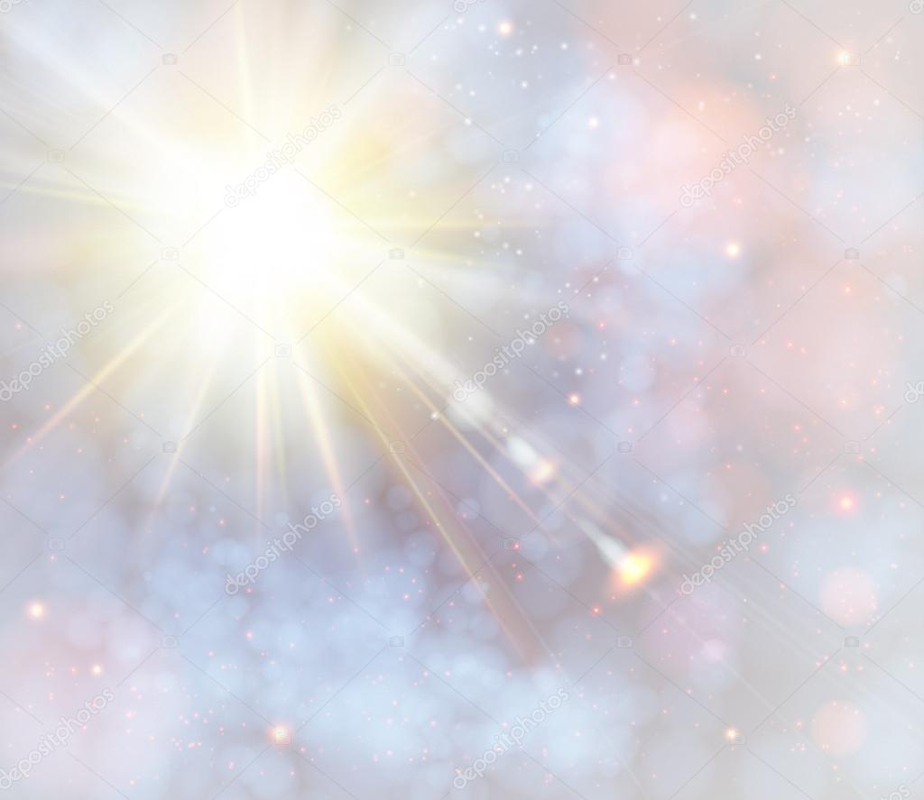 Winter shining sun with lens flare. Soft background with bokeh effect.