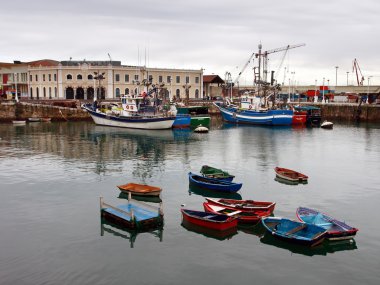 Santurtzi harbor with some ships and boats clipart