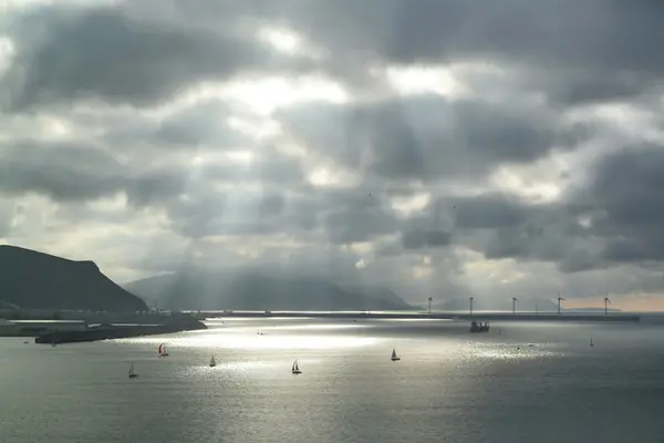 Sunbeams on the sea with sailboats — Stock Photo, Image