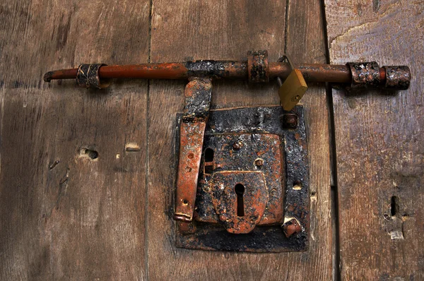 Old wooden door with lock — Stock Photo, Image