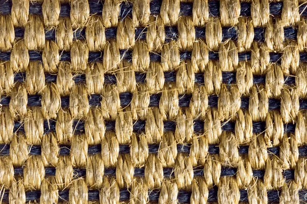 Closeup of a rogh mat of natural fiber frayed — Stock Fotó