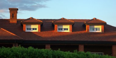 house roof with attic windows clipart