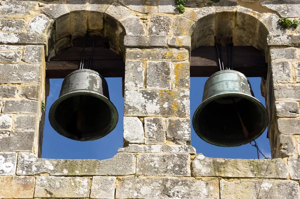 Ancient bell tower with bells and blue sky — Stock Photo, Image