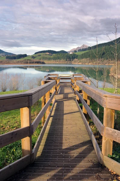 Observation post in wooden pier on a lake — Stockfoto