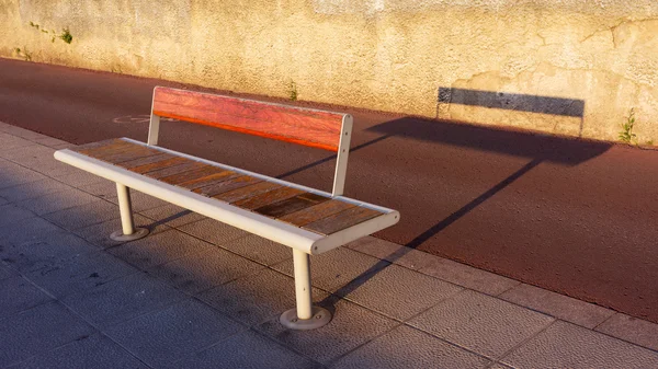 Bench on sidewalk — Stock Photo, Image