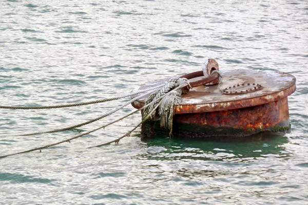 Rusty buoy on water — Stock Photo, Image