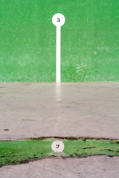 Basque pelota court with number reflection on puddle — Stock Photo, Image