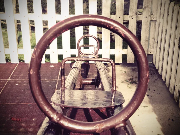 Seesaw op speelplaats met vintage ingang — Stockfoto