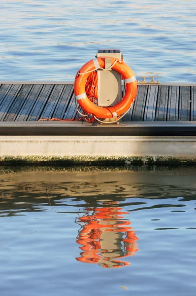 Orange lifeguard on port — Stock Photo, Image