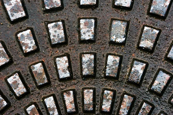 Metallic textures on sewer — Stock Photo, Image