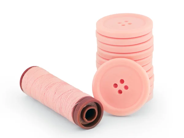 Pink sewing buttons and thread isolated — Stock Photo, Image