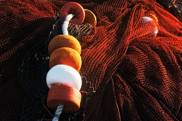 Fishing corks and net — Stock Photo, Image