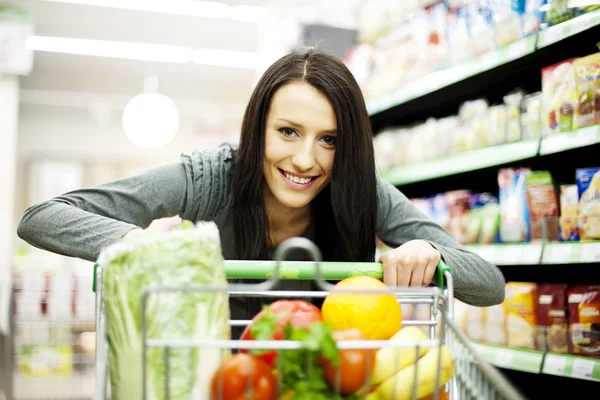Woman at supermarket Stock Photo