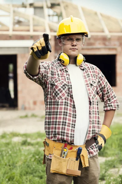 Construction worker pointing at something — Stock Photo, Image