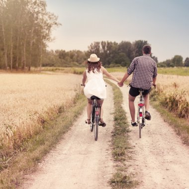 Romantic couple cycling together clipart