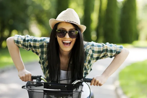 Woman with bicycle — Stock Photo, Image