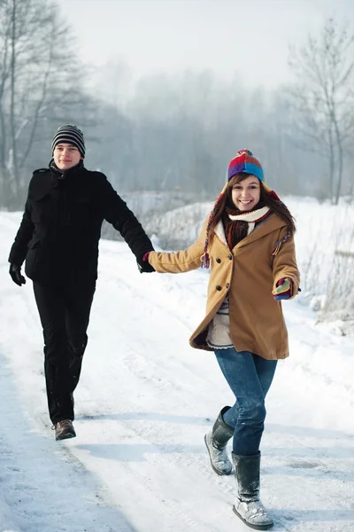 Young couple running — Stock Photo, Image