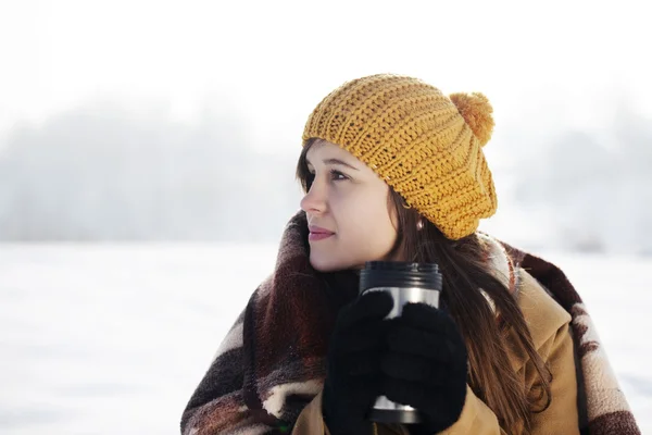 Woman drinking hot drink — Stock Photo, Image