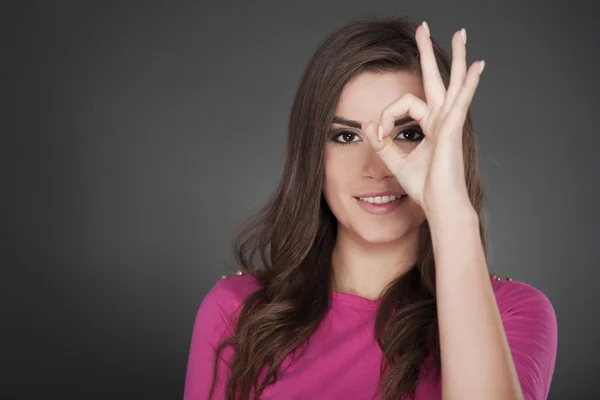 Young attractive woman showing OK — Stock Photo, Image