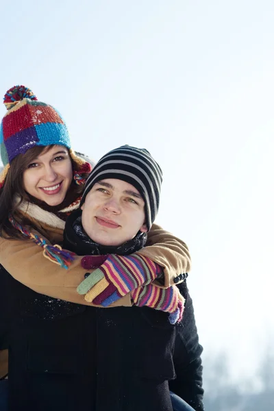 Man giving his girlfriend a piggyback ride Royalty Free Stock Photos