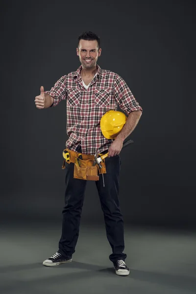 Stavební dělník ukazuje palec — Stock fotografie