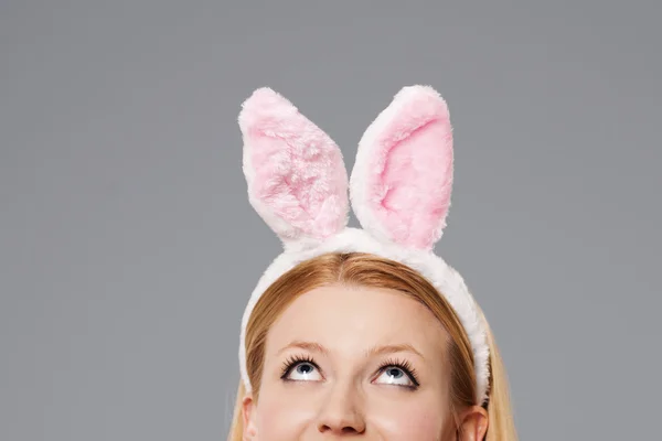 Easter bunny woman looking up — Stock Photo, Image