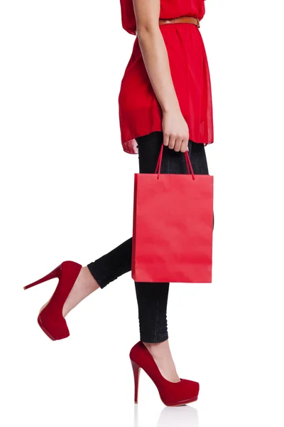 Low section of a woman with her red shopping bag — Stock Photo, Image