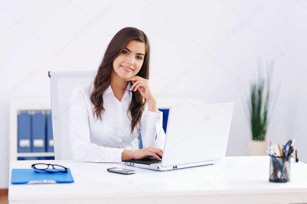 Beautiful woman working at office