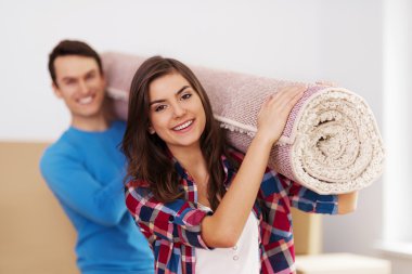 Young couple moving in to new house