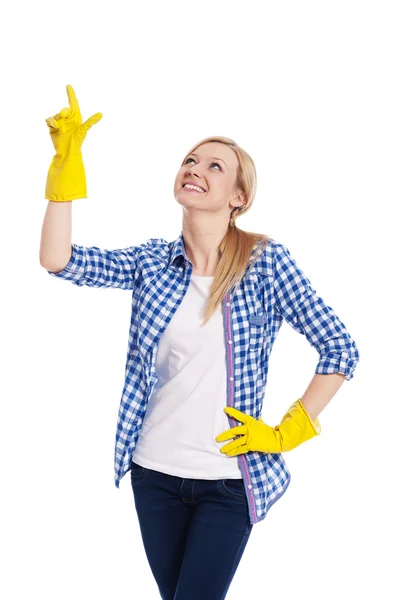 Smiling female cleaner pointing up — Stock Photo, Image