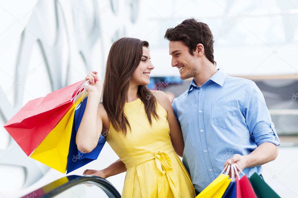 Happy young couple shopping