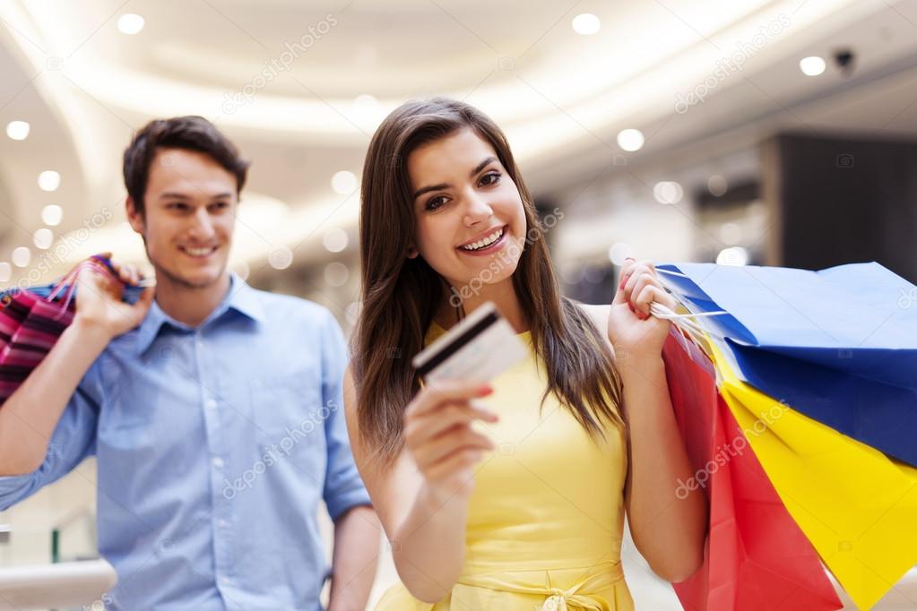 Happy young couple shopping