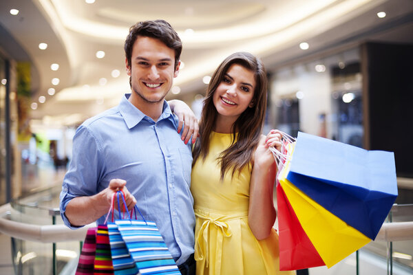 Happy couple after a successful shopping